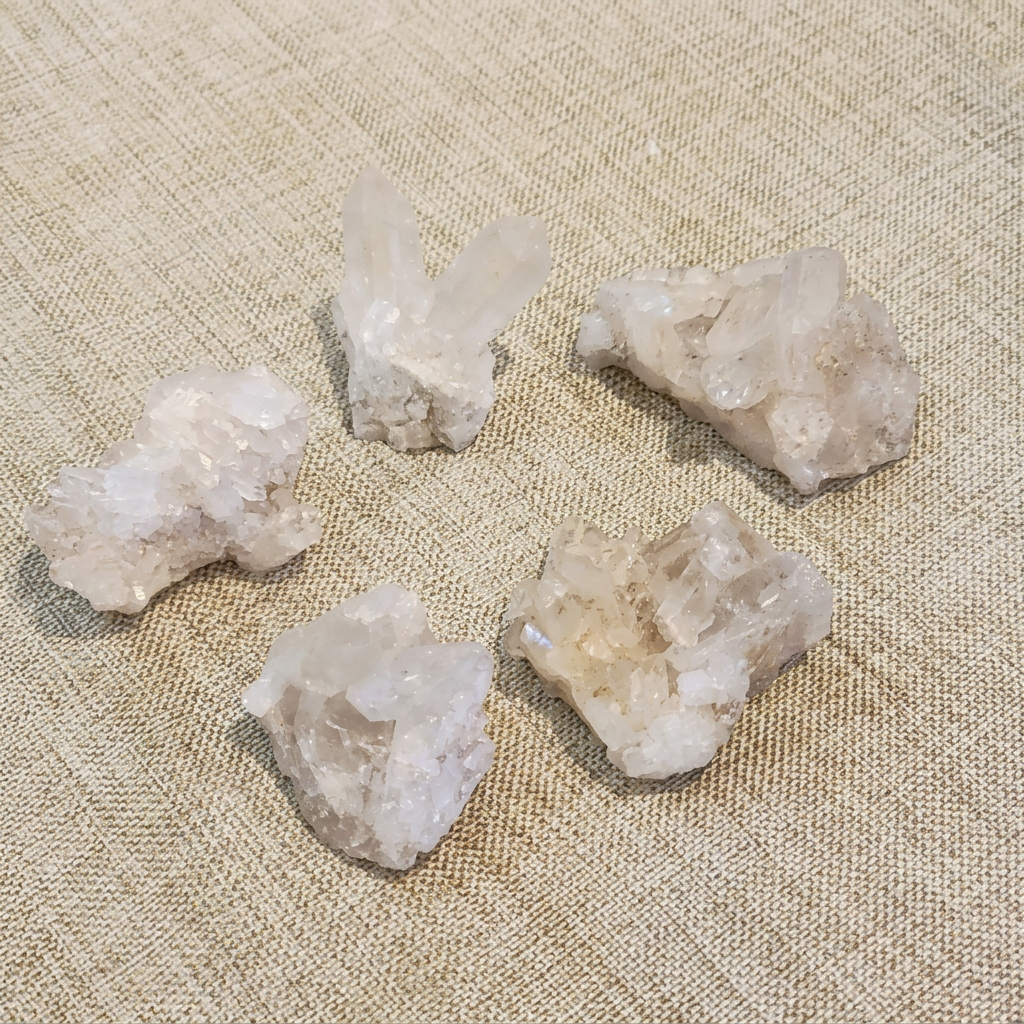 Five medium Clear Quartz clusters showing natural variation