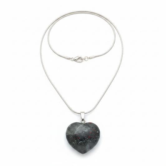 Green African Bloodstone heart pendant with chain on a white background