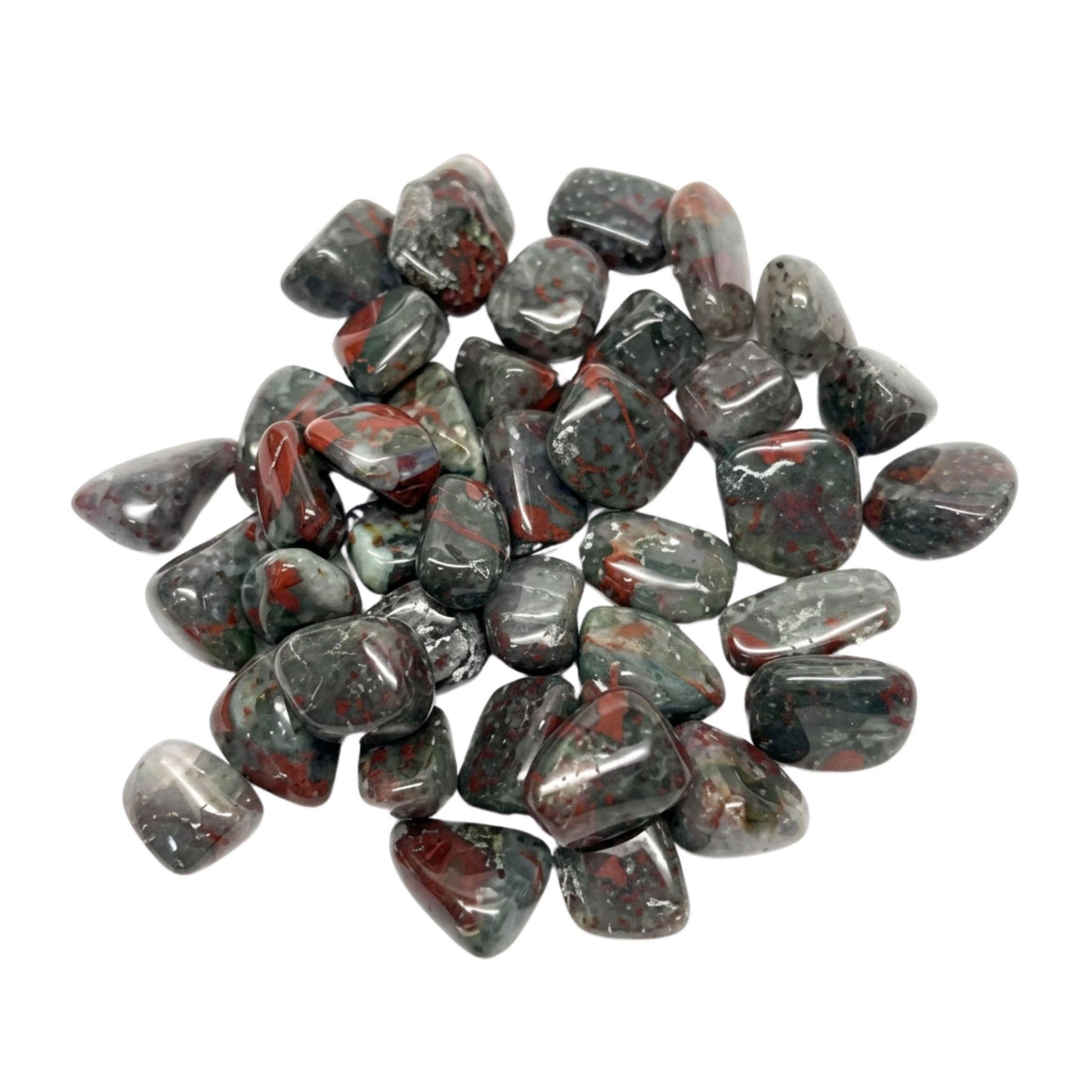 A pile of polished tumbled african bloodstone crystals in a mottled dark gray, black, and red pattern, arranged on a solid white background.