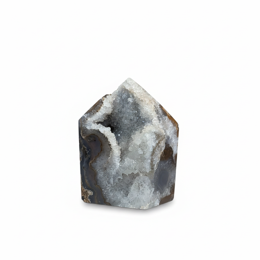 One-of-a-kind gray, white, and brown Agate Druze with polished top on a white background