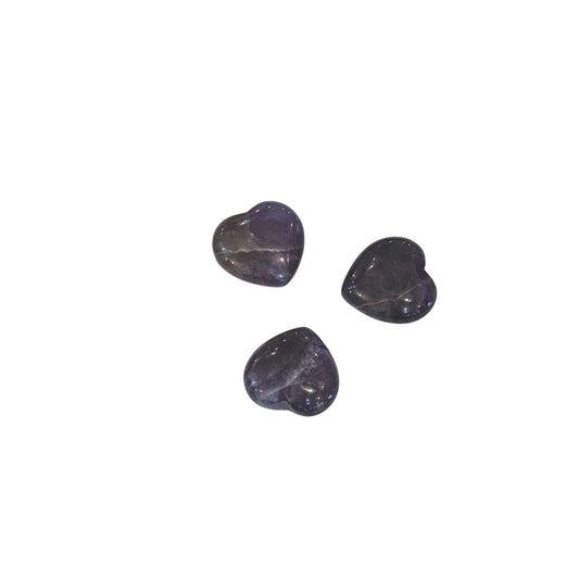 Three small heart-shaped polished dark purple amethyst stones arranged on a plain white background.
