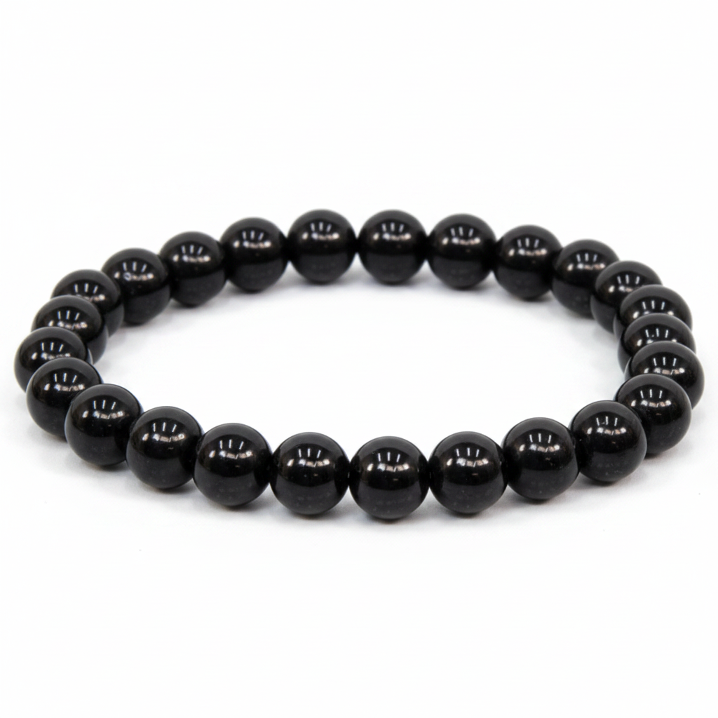 Black Obsidian 8mm beaded bracelet on white background — glossy jet black volcanic glass crystal bracelet by Prana Blessings