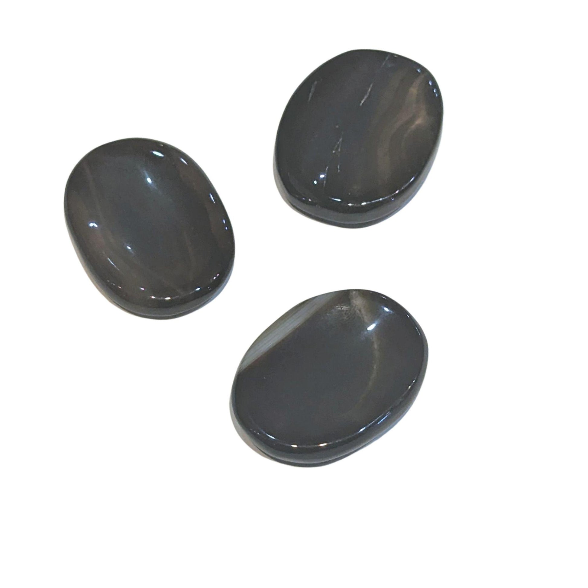 Black onyx soothing stones on a white background.