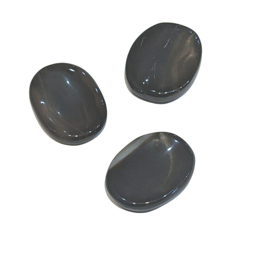 Black onyx soothing stones on a white background.