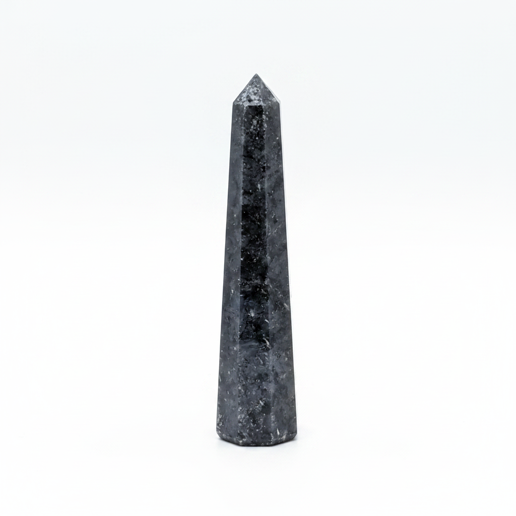 Polished Black Tourmaline obelisk, approximately 3 to 4 inches tall, on a white background