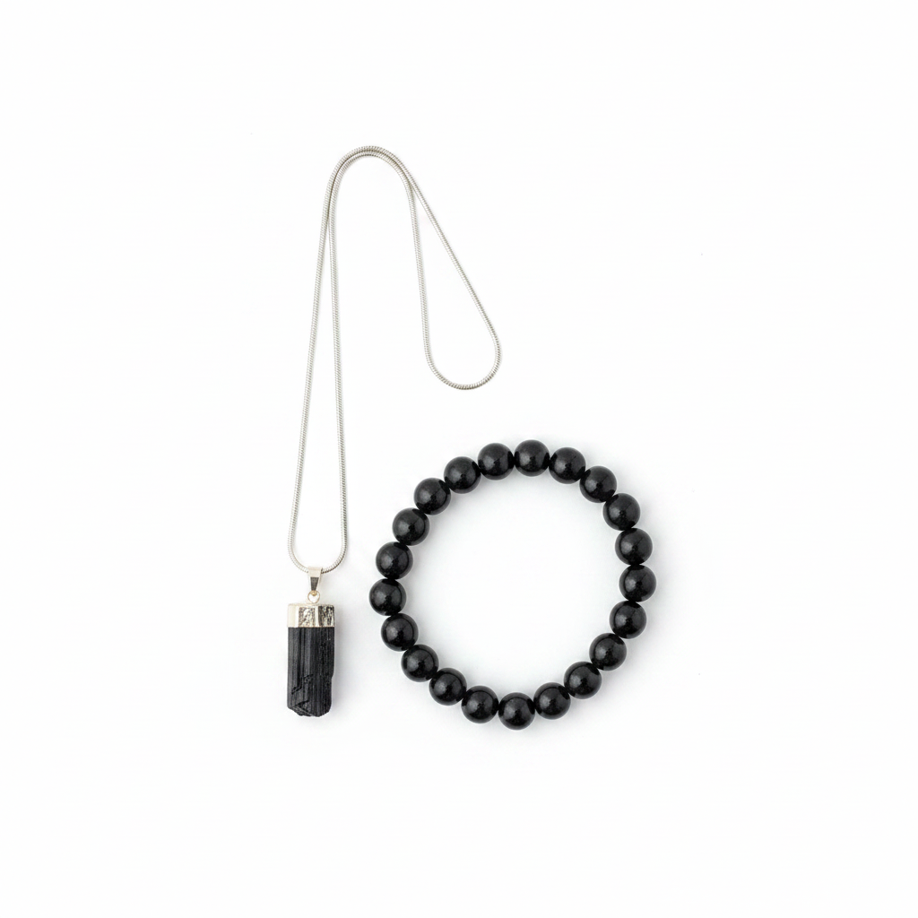 Black Tourmaline pendant and beaded bracelet set on a white background
