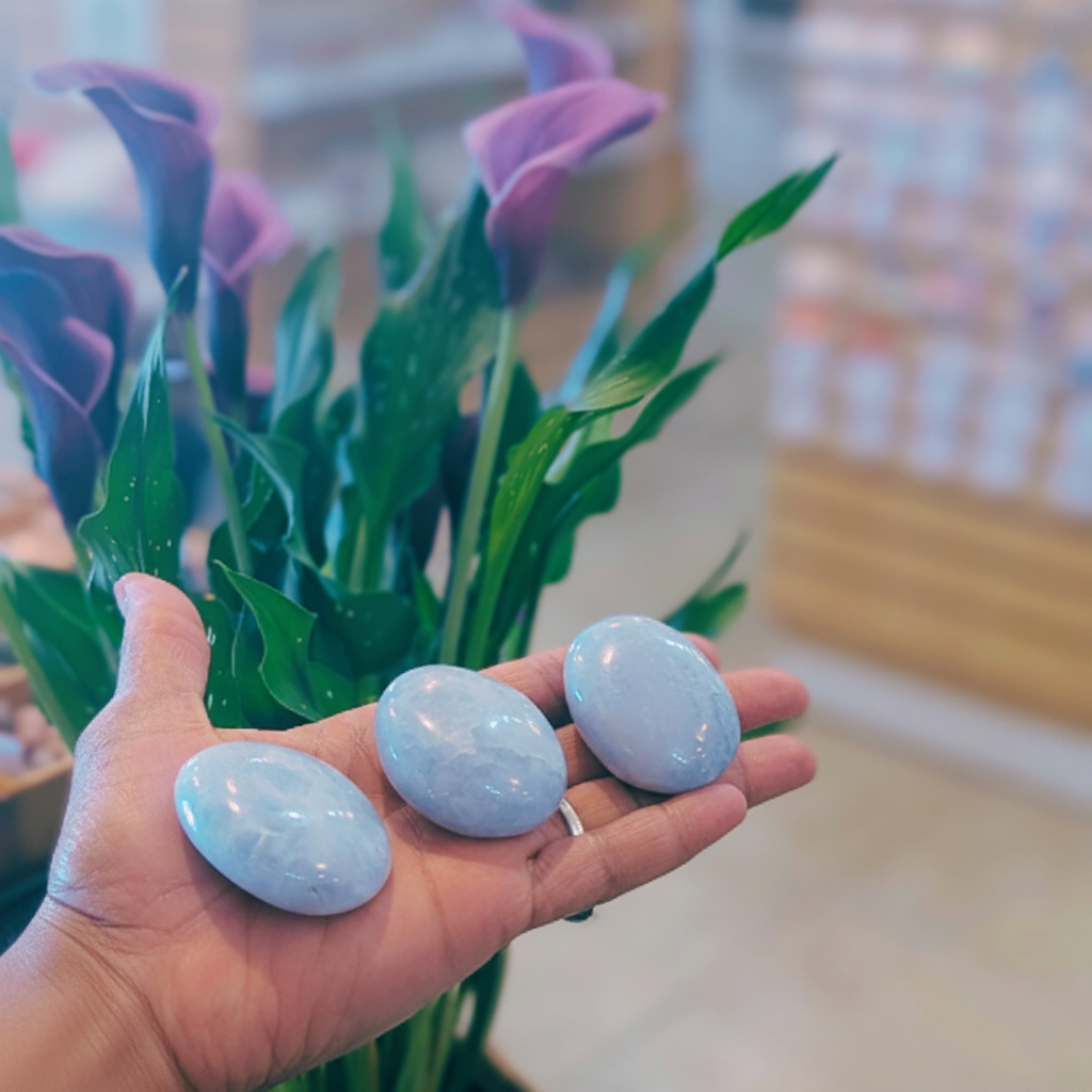 Blue Calcite Gallets Palm Stone displayed in a calm lifestyle setting for scale and styling inspiration.