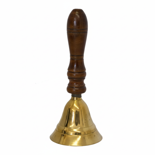 Brass bell with wooden handle on a white background