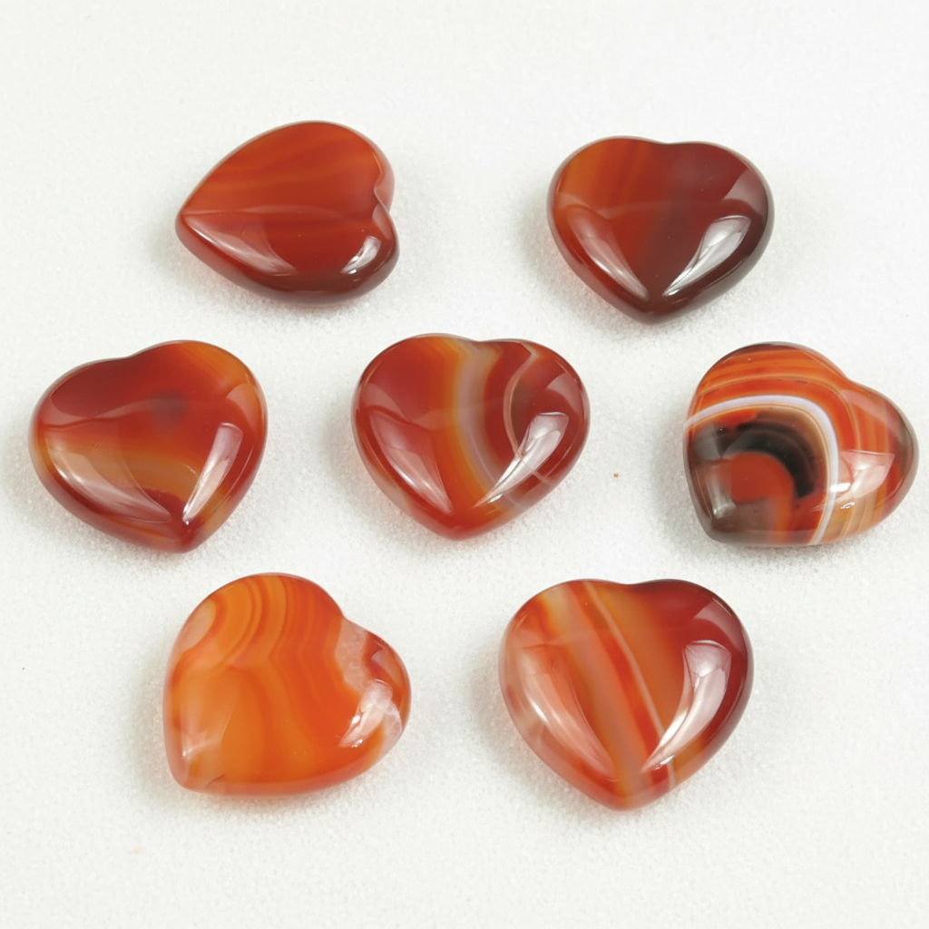 Carnelian Small Heart shown clearly on a clean white background, highlighting its color, shape, and natural variation.
