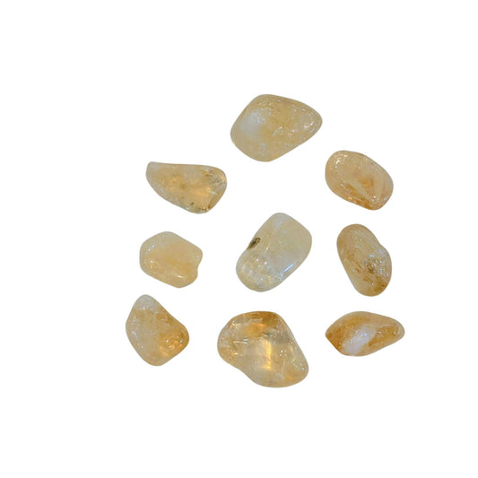 Nine polished citrine tumbled gemstones in a warm golden-yellow and cream color, arranged on a plain white background.