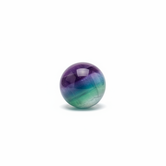 Polished 35mm multicolor Fluorite sphere on a clean light background