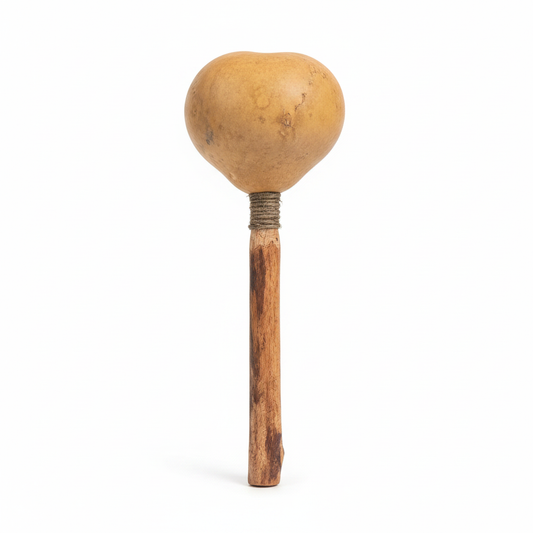 Locally handmade blue corn rattle on a white background