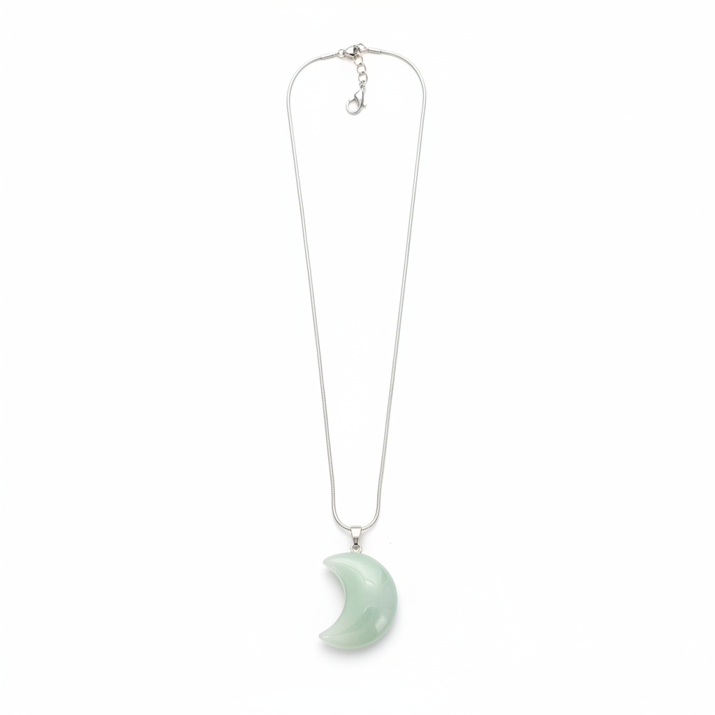 Soft green New Jade crescent moon pendant with chain on a white background