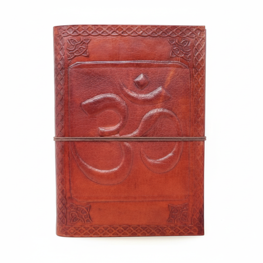 Brown leather journal with embossed Om design and cord closure on a white background