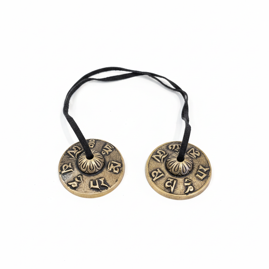 Pair of two-inch antique-brass Om Mani hand cymbals