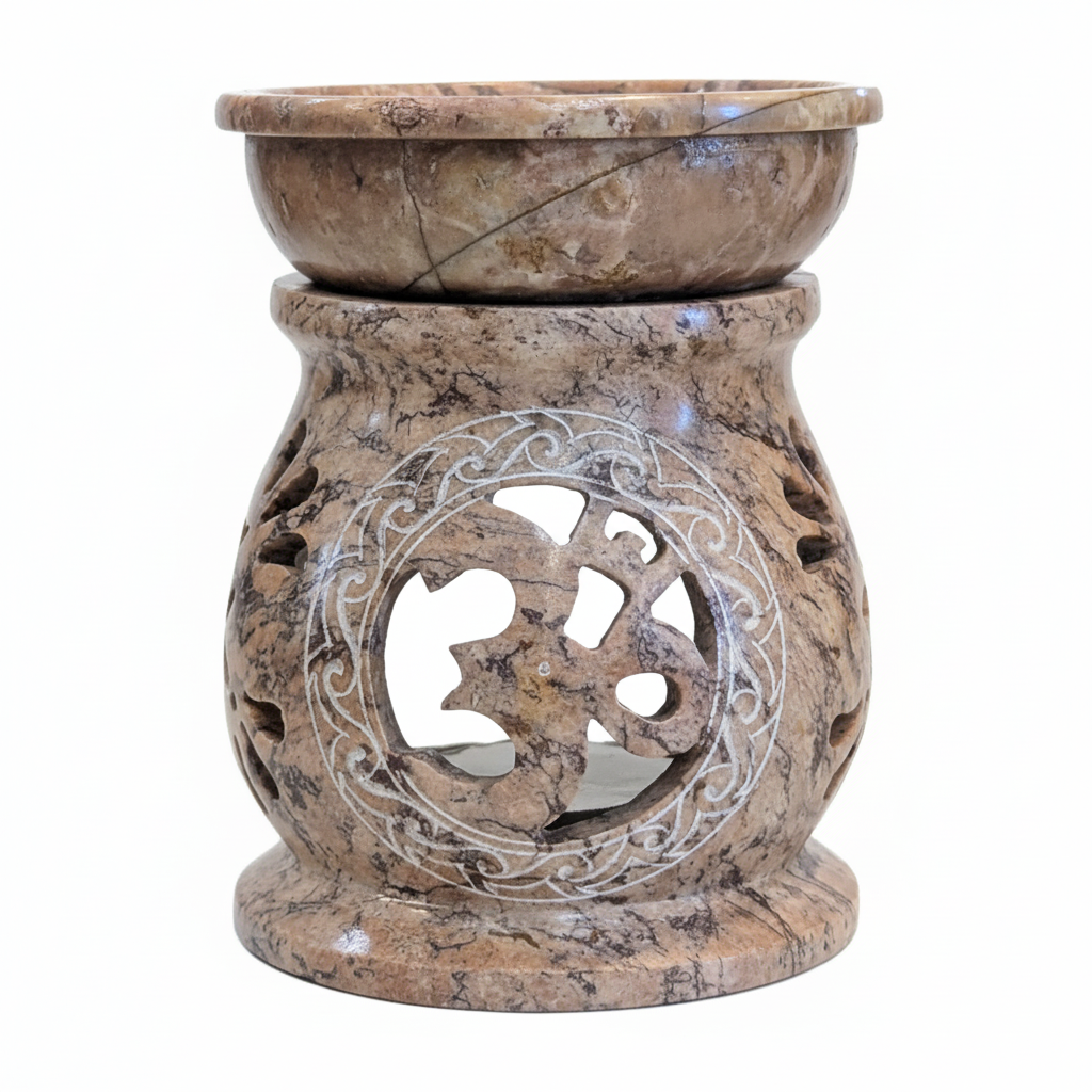 Close view of the carved Om design on the soapstone aroma oil burner