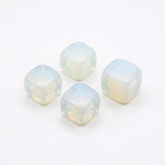 Four square opalite tumbled stones with a milky, iridescent opal-like finish, arranged on a plain white background.