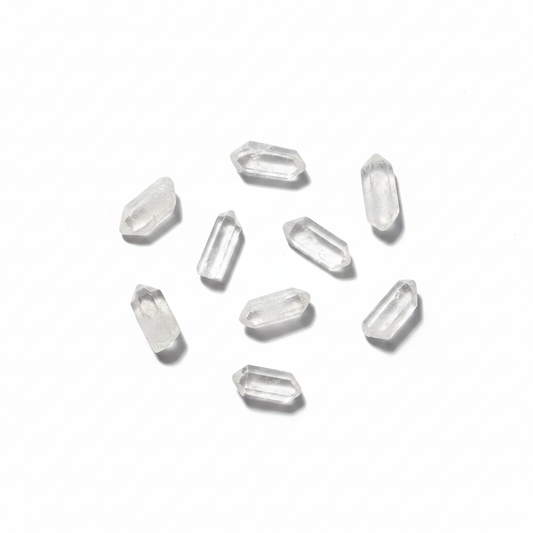 Polished Clear Quartz Points .5" - 1.5" shown clearly on a clean white background, highlighting its color, shape, and natural variation.