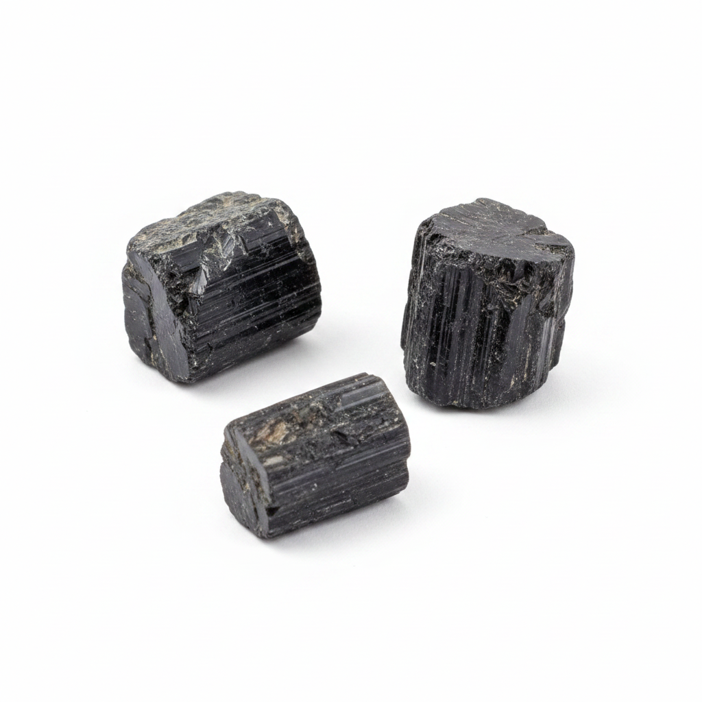 Rough Black Tourmaline natural crystal shown on a clean light background