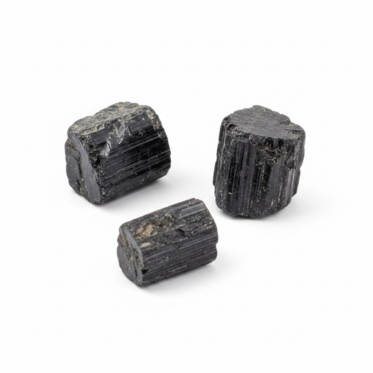 Rough Black Tourmaline natural crystal shown on a clean light background