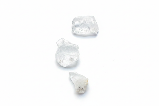 Rough Clear Quartz Chunks shown on a clean light background