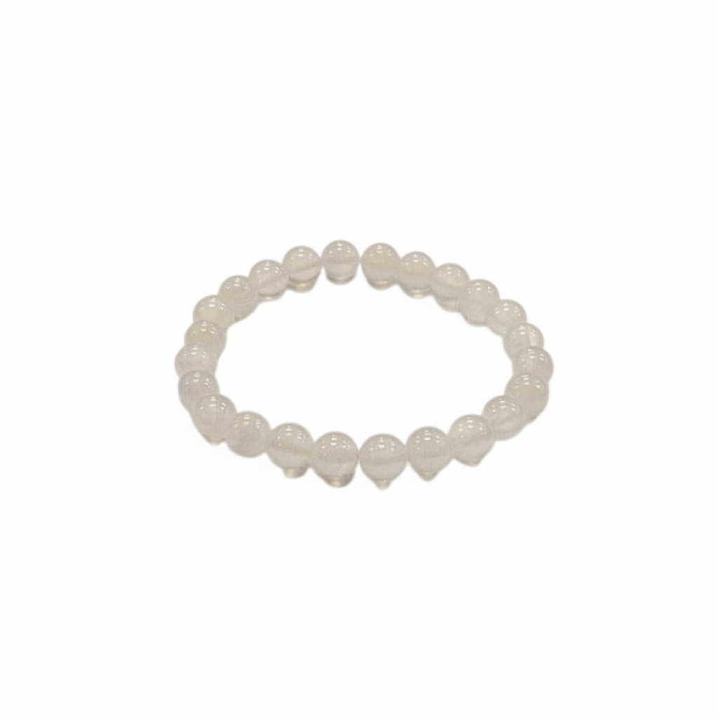 Selenite 8mm stretch bracelet with luminous white beads on a white background