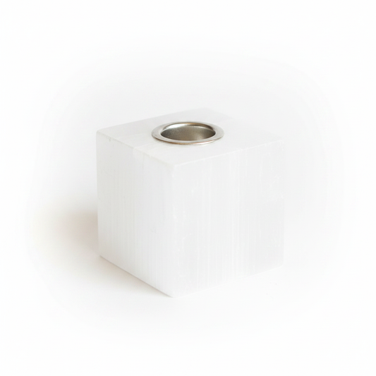 Square selenite cleansing candle holder on a white background