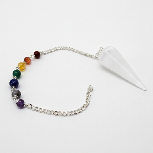 Selenite pendulum with chakra-stone chain on a white background