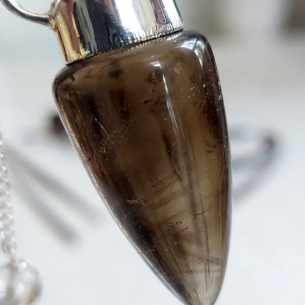 Close-up of the polished Smoky Quartz pendulum stone