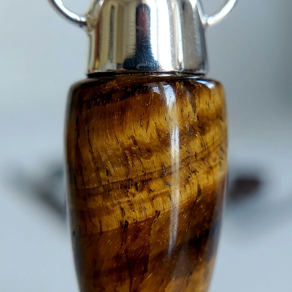 Close-up of the Tiger’s Eye stone showing natural golden-brown banding