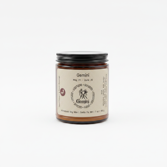 Gemini Zodiac Candle in an amber 8 oz jar on a white background