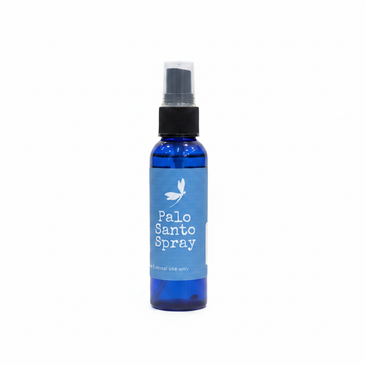 Palo Santo aromatic spray in a 2-ounce cobalt blue bottle on a white background