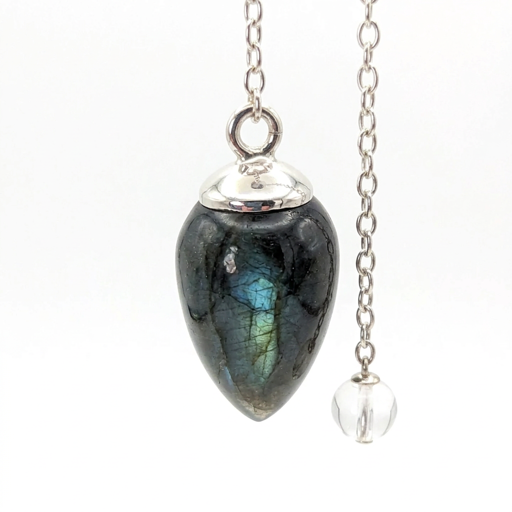 Small Labradorite Spectrolite pendulum with chain on a white background