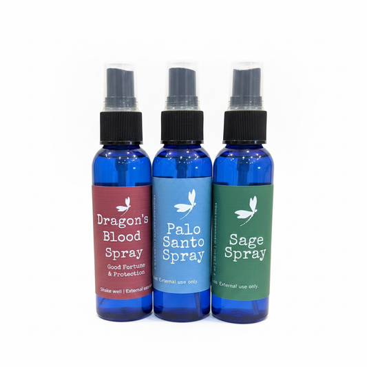Sacred Spray Bundle with Dragon's Blood, Palo Santo, and Sage sprays on a white background